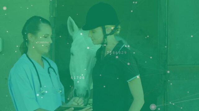 Vet tapping tablet, explaining exam results for horse health to rider, horse nudging between them