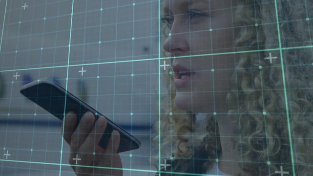 Holding phone by mouth, woman dictating, adjusting phone, necklace-watch, teal-grid, shelving