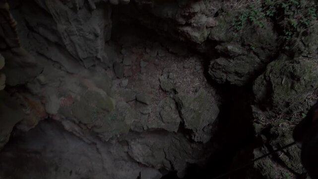 Tham Pong cave, abseiling above the large sink hole and looking down into the abyss.