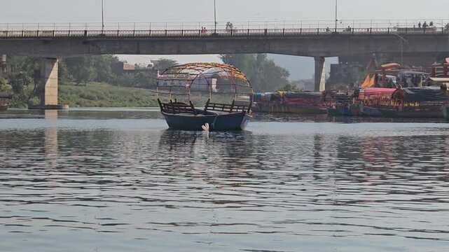 Scenic view from a moving boat at Ram Ghat in Chitrakoot, Madhya Pradesh, on the sacred Mandakini River. This spiritual riverside location is associated with Lord Rama, Sita, and Lakshman.