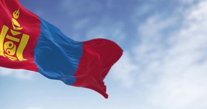 Mongolia national flag waving in the wind on a clear day. Red, blue, red stripes, yellow Soyombo on left red. Seamless 3d render animation. Slow motion loop. Selective focus