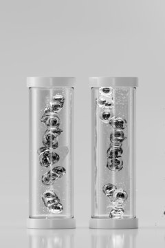 3D liquid capsule column in clear vessel with suspended bubble