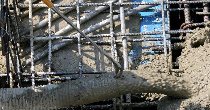Concrete pouring on rebar at construction site, showing the power of civil engineering.