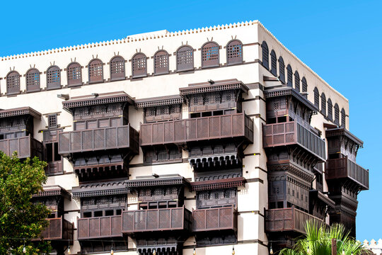 Traditional wooden Mashrabiya windows on an ancient building in Al-Balad, Historic Jeddah. A stunning UNESCO site showcasing authentic Saudi landmarks.
