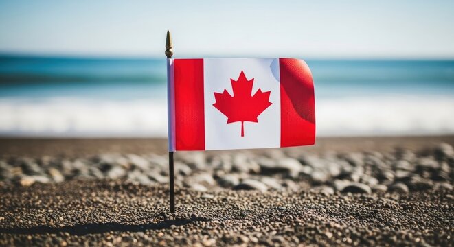 Canadian flag on a beach a symbol of national pride against a coastal backdrop