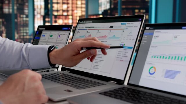 Quality Manager Reviewing Corrective Actions On Laptop