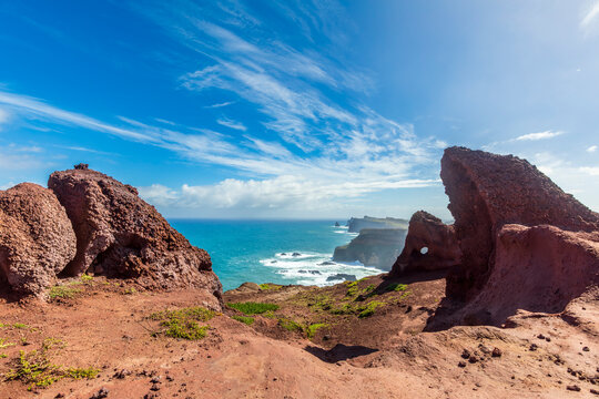 Colorful rock formations at Miradouro do Calhau Madeira with ocean view