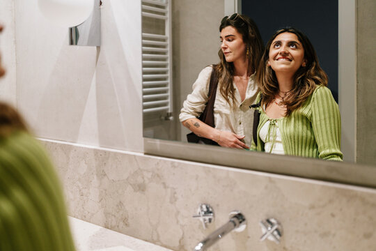 Couple consulting in bathroom during apartment visit for property purchase