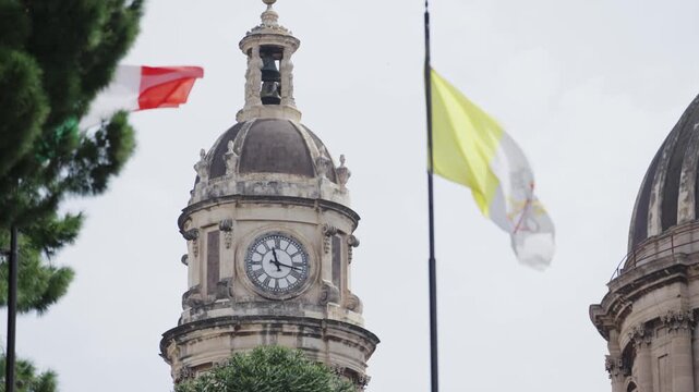 Waving Flags & Grand Clock Tower in Historic Catania, Italy