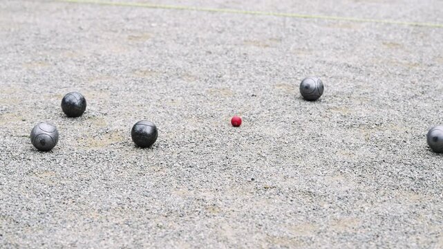 Slow Motion Petanque Game: Leisurely Day in Barcelona, Spain