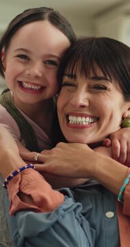 Face, mama and child in home for love, kiss cheek and embrace with parent for happiness. Mom, girl and hug in lounge with kid for connection, trust and support for care with portrait on mothers day