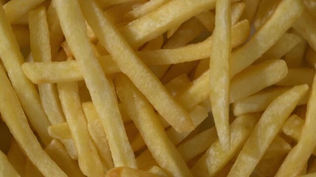 Top down close up of rotating french fries background texture