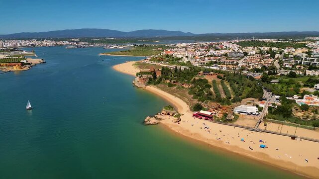Aerial View on Ferragudo in Algarve Portugal, flying backwards