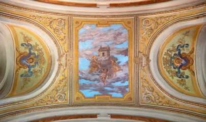 Fototapeta premium Ivrea - The ceiling fresco of angels with House of Nazareth in the church Chiesa di San Salvatore by G. Silvestro from end of 19. cent. 