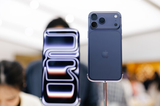 Guangzhou, China - December 31, 2025: blue Apple iphone 17 pro max smartphones displayed on security stands in retail store