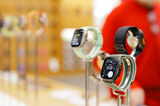 Guangzhou, China - December 31, 2025: Ultra Apple watch Smartwatch on display with blurred shoppers in store digital device
