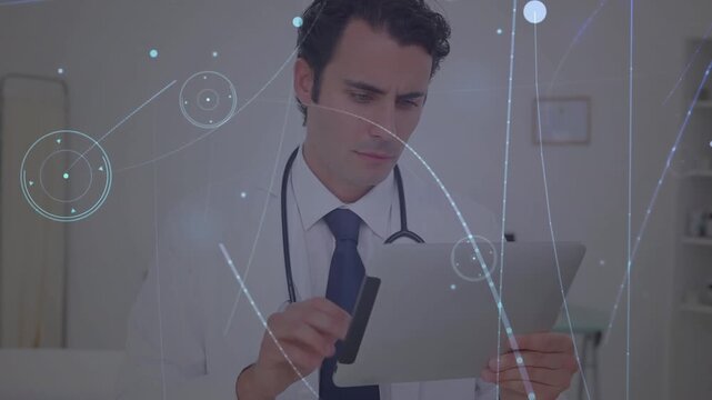 Animation of dots in circles connected with lines and lens flare over caucasian doctor using tablet