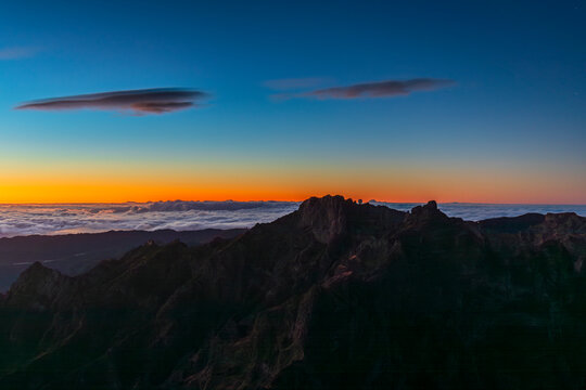 Dusk over Pico Ruivo and Pico do Arieiro mountains in Madeira Portugal