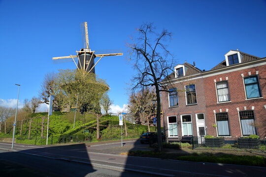 The windmill Windhond (built in 1755) and historic houses in Woerden, Utrecht, Netherlands