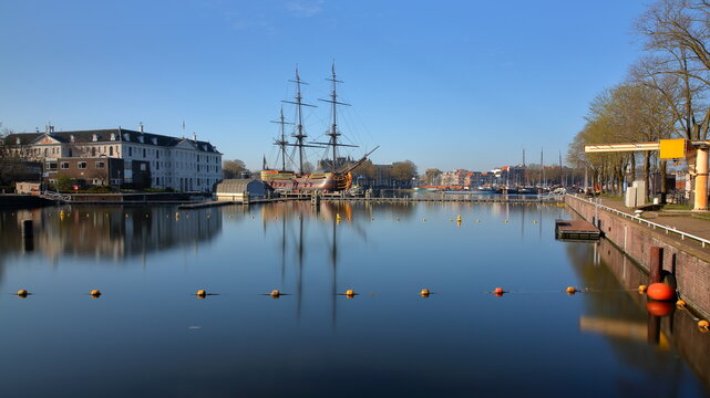 AMSTERDAM, NETHERLANDS - MARCH 04, 2026: Het Scheepvaart Museum (National Maritime Museum) located in Oosterdok neighborhood and viewed from a popular outdoor canal swimming (Marineterrein)