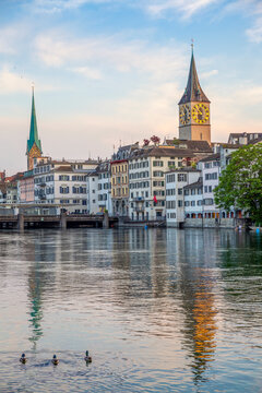 Zurich cityscape with St. Peter and Fraum�nster churches at sunset