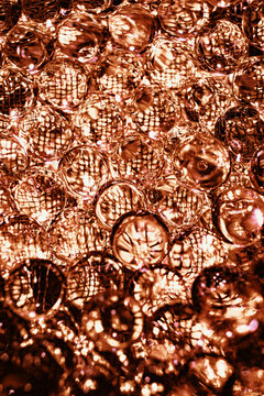 Abstract closeup of many spherical bubbles with glossy reflections