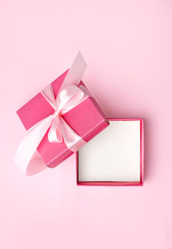 Verical jewellery, beauty showcase, template. Jewelry display,cosmetics advertisement blank.Pink opened empty gift box top view.Mother's day.