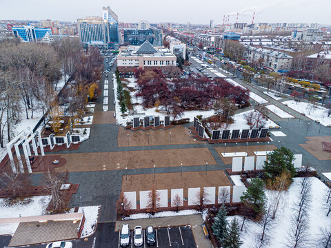 High-angle drone shot (top-down / bird's-eye view) of Memory Square (Ploshchad Pamyati), a major war memorial complex in Tyumen, Russia, captured on October 21, 2021, using a DJI Mini 2. The square is
