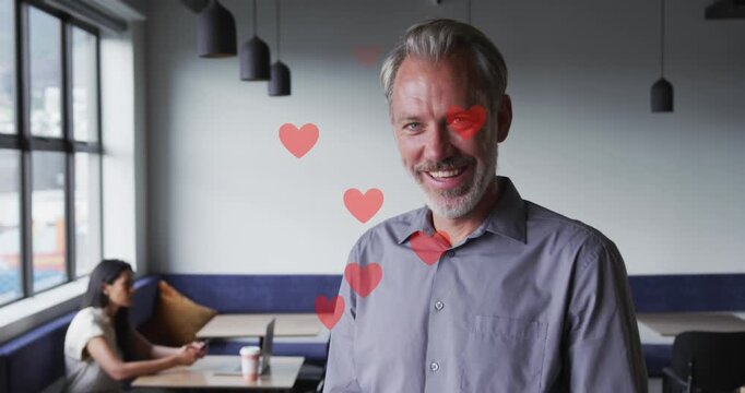 Animation of red pattern over caucasian male doctor with face mask