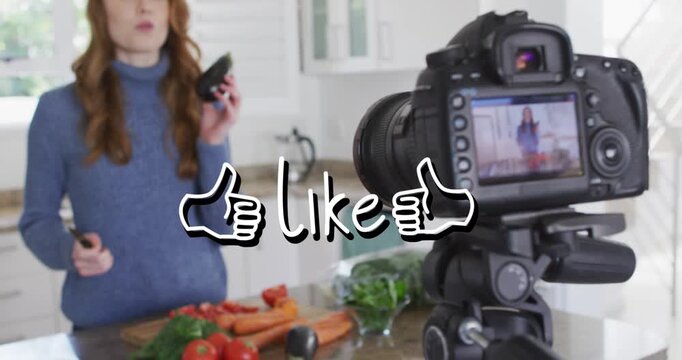 Animation of like text over caucasian woman cooking, making vlog using camera