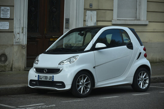 Mulhouse - France - 10 April 2026 - profile view of white smart car parked in the street