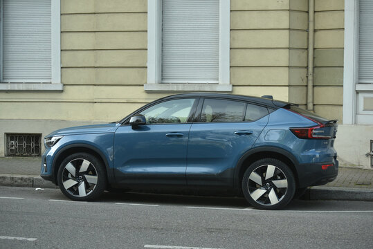 Mulhouse - France - 10 April 2026 - profile view of blue Volvo C40 parked in the street