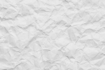 Naklejka premium Crumpled White Paper Texture Background,Top view of a blank, crumpled white paper texture. The wrinkled surface creates subtle shadows and highlights, perfect for use as a background, overlay,Macro
