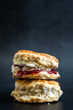 Stacked biscuits with butter and strawberry jam