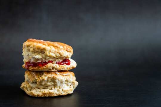 Stacked biscuits with butter and strawberry jam