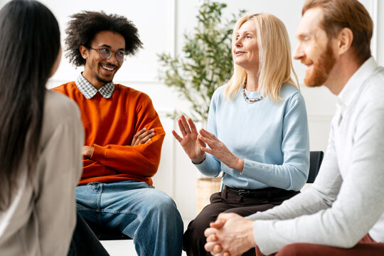 Diverse group having discussion in support meeting
