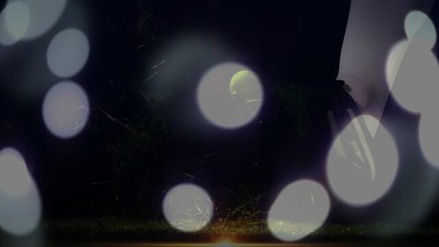 ROMANIA ball glowing on turf, player approaching, cleated foot striking for sports, bokeh drifting