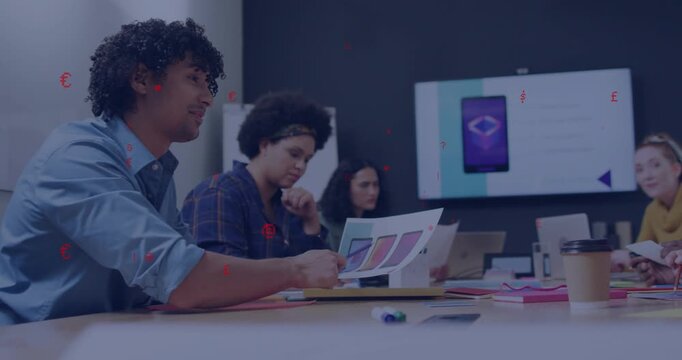 Man presenting color swatches, team reviewing smartphone mockup and discussing design choices