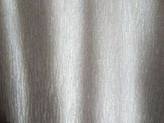 Fototapeta premium Light shines through flowing fabric in a bright room during daytime hours