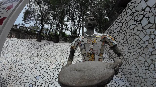 Traditional Human Statue Crafted from Recycled Ceramic Tiles and Waste Materials in a Public Rock Garden, Chandigarh, India 