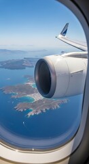 Fototapeta premium Aerial view of an airplane engine and wing over the ocean.