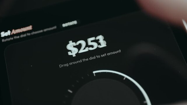 Finger drags the arrow around the dial to set the amount for payment