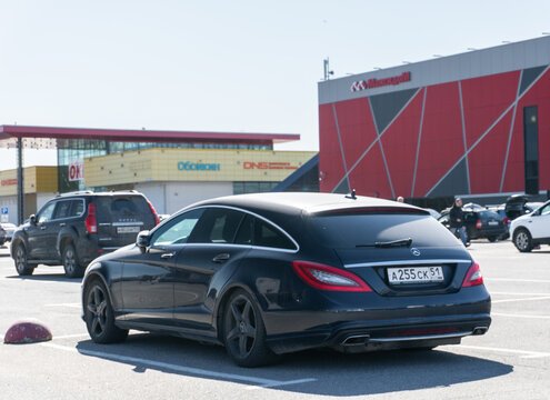 Black Mercedes-Benz CLS-Class 350 (C218) sedan parked on street. Exterior of a black Mercedes-Benz CLS 350 W218 Shooting Brake parking lot in the center of the town. Germany premium car. 