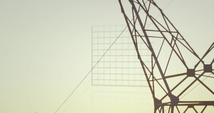 Animation of data processing over electricity pylon and landscape