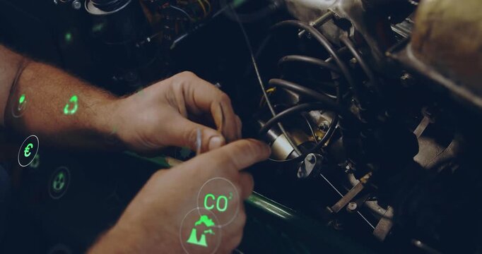 Automotive mechanic grabbing hose clamp aligning fuel injector and monitoring energy icons shifting