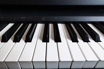 Fototapeta premium Macro shot of digital piano keys with shallow depth of field