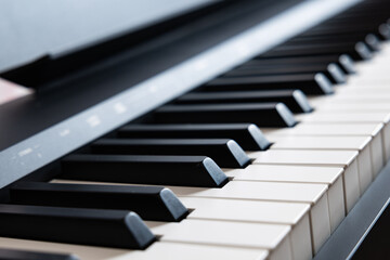 Naklejka premium Macro shot of digital piano keys with shallow depth of field