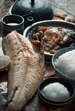 Indulge in a quintessential Japanese tradition with this Charcoal-Grilled Shima Hokke Teishoku. At its heart lies a substantial fillet of Okhotsk atka mackerel, meticulously seared to achieve a shatte