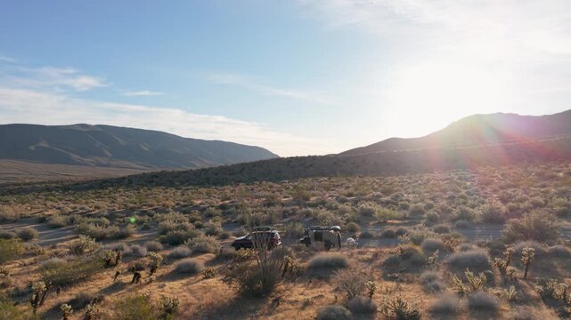 Aerial view shows a teardrop camper trailer set up in Anza Borrego Desert State Park under the sun in Plum Canyon area.