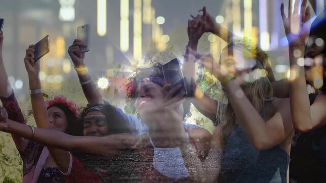 Crowd raising phones and recording after hearing music, with flashes and bokeh layering over